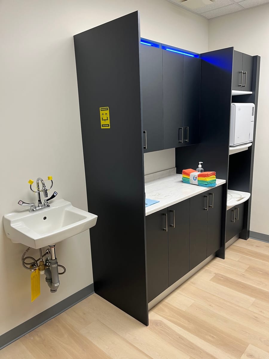 The clinic's sterilisation bay, with the autoclave, hand basin and clean instrument counter